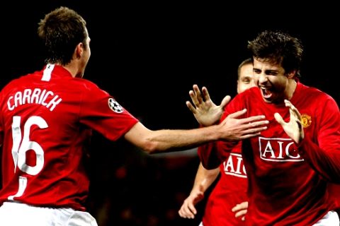 Manchester United's Gerard Pique, right, celebrates with teammate Michael Carrick,  after scoring against Dynamo Kiev during their Champion's League Group F soccer match at Old Trafford Stadium, Manchester, England, Wednesday Nov. 7, 2007. (AP Photo/Jon Super)