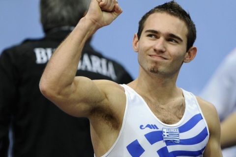Eleftherios Kosmidis of Greece celebrates his victory after his performance during the men's floor finals at the Artistic Gymnastics World Championships in Rotterdam October 23, 2010. REUTERS/Dylan Martinez (NETHERLANDS - Tags: SPORT GYMNASTICS)