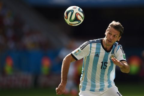 Argentina's defender Martin Demichelis eyes the ball during a quarter-final football match between Argentina and Belgium at the Mane Garrincha National Stadium in Brasilia during the 2014 FIFA World Cup on July 5, 2014. AFP PHOTO / PEDRO UGARTE        (Photo credit should read PEDRO UGARTE/AFP/Getty Images)