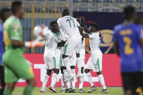 Senegal's players celebrate after they scored second goal during the African Cup of Nations group C soccer match between Senegal and Tanzania at 30 June Stadium in Cairo, Egypt, Sunday, June 23, 2019. (AP Photo/Hassan Ammar)