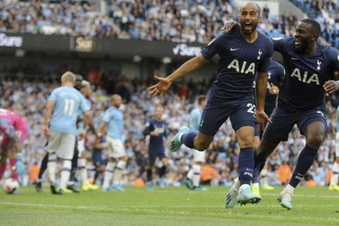 Tottenham's Lucas Moura, left, celebrates after scoring his side's second goal during the English Premier League soccer match between Manchester City and Tottenham Hotspur at Etihad stadium in Manchester, England, Saturday, Aug. 17, 2019. (AP Photo/Rui Vieira)