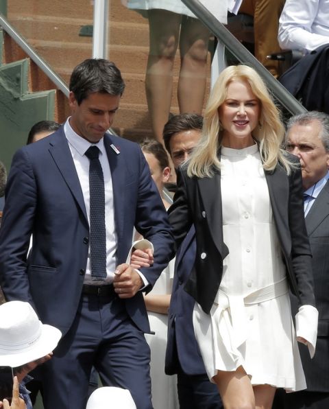 Actress Nicole Kidman and French Olympic champion Tony Estanguet arrive before Spain's Rafael Nadal plays Switzerland's Stan Wawrinka in their final match of the French Open tennis tournament at the Roland Garros stadium, Sunday, June 11, 2017 in Paris. (AP Photo/Michel Euler)