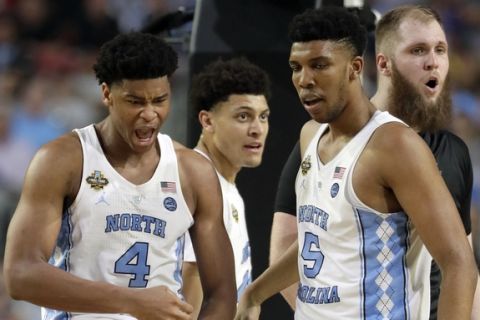North Carolina's Isaiah Hicks (4) and Tony Bradley (5) react to a call during the second half in the finals of the Final Four NCAA college basketball tournament against Gonzaga, Monday, April 3, 2017, in Glendale, Ariz. (AP Photo/Mark Humphrey)