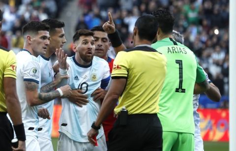 Argentina's Lionel Messi, center, reacts after receiving from referee Mario Diaz, from Paraguay, a red card during Copa America third-place soccer match against Chile at the Arena Corinthians in Sao Paulo, Brazil, Saturday, July 6, 2019. (AP Photo/Victor R. Caivano)