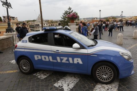 An Italian Police is parked car atop the Spanish Steps hours before the Champions League semifinal second leg soccer match between Liverpool and Roma, scheduled at the Olympic stadium, in Rome, Wednesday, May 2, 2018. (AP Photo/Riccardo De Luca)