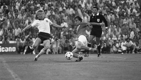Italy?s Marco Tardelli, right, hits the ball past West German defender Bernd Forster, to score his teams second goal, during the Football World Cup Final in the Santiago Bernabau Stadium, Madrid,on July 11, 1982. Italy defeated West Germany 3-1. (AP Photo)