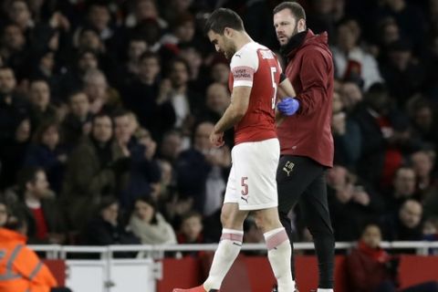 Arsenal's Sokratis Papastathopoulos leaves the field during the English FA Cup fourth round soccer match between Arsenal and Manchester United at the Emirates stadium in London, Friday, Jan. 25, 2019. (AP Photo/Matt Dunham)