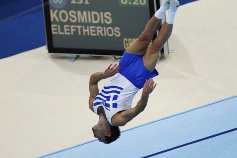 Eleftherios Kosmidis of Greece performs during the men's floor finals at the Artistic Gymnastics World Championships in Rotterdam October 23, 2010. REUTERS/Jerry Lampen (NETHERLANDS - Tags: SPORT GYMNASTICS)