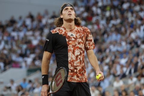 Greece's Stefanos Tsitsipas reacts after missing a shot against Spain's Carlos Alcaraz during their quarterfinal match of the French Open tennis tournament at the Roland Garros stadium in Paris, Tuesday, June 6, 2023. (AP Photo/Jean-Francois Badias)
