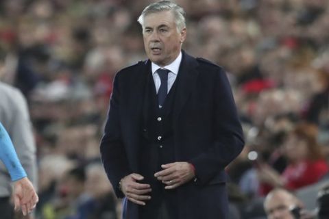 Napoli's head coach Carlo Ancelotti watches during the Champions League Group E soccer match between Liverpool and Napoli at Anfield stadium in Liverpool, England, Wednesday, Nov. 27, 2019. (AP Photo/Jon Super)