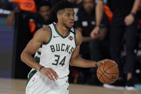 Milwaukee Bucks' Giannis Antetokounmpo (34) in the second half of an NBA conference semifinal playoff basketball game against the Miami Heat Friday, Sept. 4, 2020, in Lake Buena Vista, Fla. (AP Photo/Mark J. Terrill)