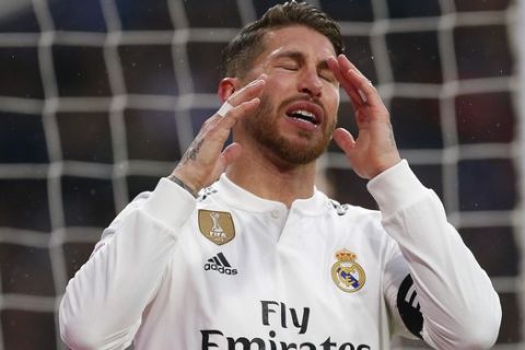 Real Madrid's Sergio Ramos reacts after failing to score during a La Liga soccer match between Real Madrid and Sevilla at the Bernabeu stadium in Madrid, Spain, Saturday, Jan. 19, 2019. (AP Photo/Andrea Comas)
