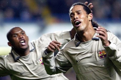 Barcelona's Samuel Eto'o, left, and goalscorer Ronaldhino celebrate in the UEFA Champions League first knock-out 2nd legTuesday March 8, 2005,  being played against Cheslea at Chelsea's Stamford Bridge ground in London. (AP Photo/Dave Caulkin)    