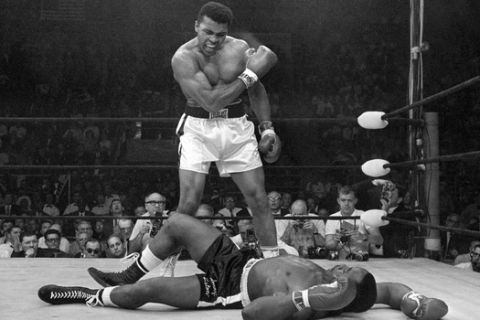 FILE - In this May 25, 1965, file photo, Muhammad Ali stands over Sonny Liston after knocking Liston down during their' heavyweight championship bout in Lewiston, Maine. (AP Photo/John Rooney, File)