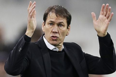 FILE - In this Tuesday, Jan. 16, 2018 file photo, Marseille's coach Rudi Garcia directs his players during the League One soccer match between Marseille and Strasbourg, at the Velodrome stadium, in Marseille, southern France. Marseille will play Atletico Madrid in the Europa League final on Wednesday May 16, 2018. Marseille now enjoys significant financial backing and the time is right to stop harping on about past glory and deliver another trophy. Atletico is bidding to win the Europa League for the third time this decade. (AP Photo/Claude Paris, File)