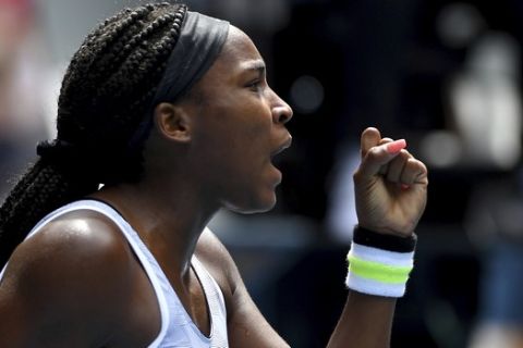 Coco Gauff of the U.S. reacts to winning a point against compatriot Sofia Kenin during their fourth round singles match at the Australian Open tennis championship in Melbourne, Australia, Sunday, Jan. 26, 2020. (AP Photo/Andy Brownbill)