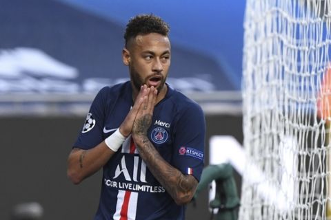 PSG's Neymar reacts after missing an opportunity to score during the Champions League semifinal soccer match between RB Leipzig and Paris Saint-Germain at the Luz stadium in Lisbon, Portugal, Tuesday, Aug. 18, 2020. (David Ramos/Pool Photo via AP)