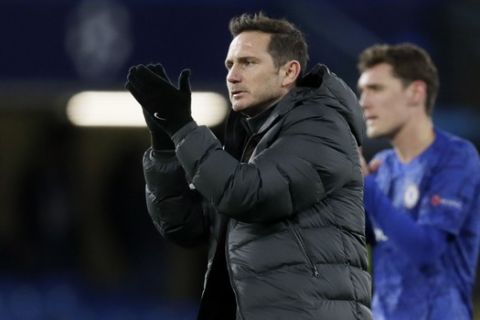 Chelsea's head coach Frank Lampard applauds fans at the end of the first leg, round of 16, Champions League soccer match between Chelsea and Bayern Munich at Stamford Bridge stadium in London, England, Tuesday Feb. 25, 2020. (AP Photo/Kirsty Wigglesworth)
