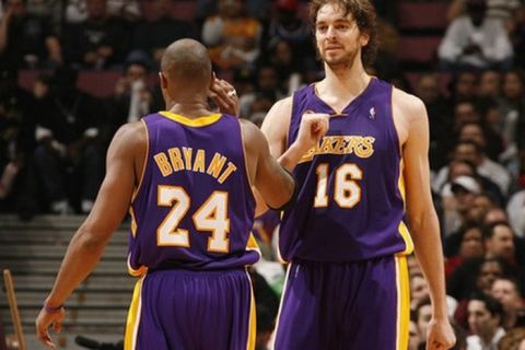 EAST RUTHERFORD, NJ - FEBRUARY 5:  Kobe Bryant #24 of the Los Angeles Lakers high-fives teammate Pau Gasol #16 while playing against the New Jersey Nets on February 5, 2008 at the IZOD Center in East Rutherford, New Jersey. NOTE TO USER: User expressly acknowledges and agrees that, by downloading and or using this photograph, User is consenting to the terms and conditions of the Getty Images License Agreement. Mandatory Copyright Notice: Copyright 2008 NBAE (Photo by Nathaniel S. Butler/NBAE via Getty Images)