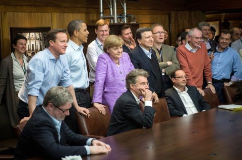 CAMP DAVID, MD - MAY 19:  British Prime Minister David Cameron, U.S. President Barack Obama, German Chancellor Angela Merkel, EU Commission President Jose Manuel Barroso, President of the European Council Herman Van Rompuy and Russian Prime Minister Dmitry Medvedev watch the UEFA Champions League Final between FC Bayern Muenchen and Chelsea FC during the 2012 G8 Summit at Camp David on May 19, 2012 in Camp David, Maryland. Leaders of eight of the worlds largest economies are meeting over the weekend in an effort to keep the lingering European debt crisis from spinning out of control.  (Photo by Guido Bergmann-Pool/Getty Images)