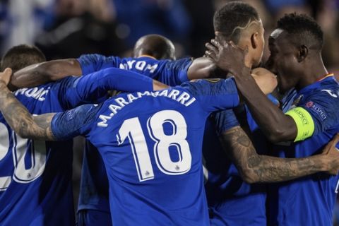 Getafe's Kenedy, second right, is congratulated after scoring during a 1st leg, round of 32, of the Europa League soccer match at the Coliseum Alfonso Perez stadium in Getafe, outskirts of Madrid, Spain, Thursday, Feb. 20, 2020. (AP Photo/Bernat Armangue)