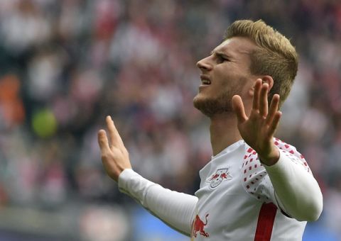 Leipzig's Timo Werner cheers after scoring  during the German Bundesliga match between RB Leipzig and Eintracht Frankfurt at the Red Bull Arena in Leipzig, Germany,  Saturday, Sept. 23, 2017.  (Hendrik Schmidt/dpa via AP)