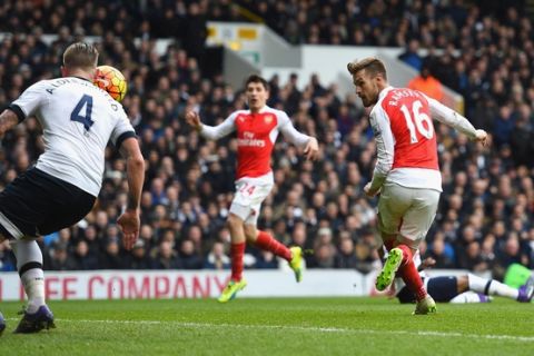 LONDON, ENGLAND - MARCH 05:  Aaron Ramsey of Arsenal scores his team's first goal during the Barclays Premier League match between Tottenham Hotspur and Arsenal at White Hart Lane on March 5, 2016 in London, England.  (Photo by Shaun Botterill/Getty Images)