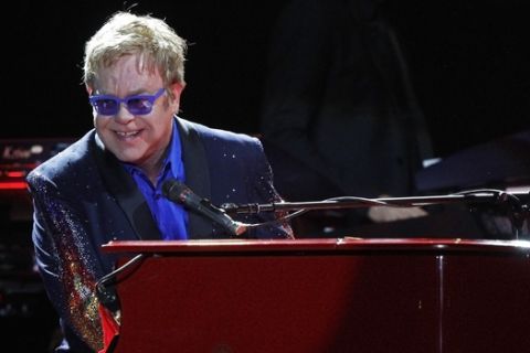Elton John performs at the Bonnaroo Music and Arts Festival on Sunday, June 15, 2014, in Manchester, Tenn. (Photo by Wade Payne/Invision/AP)