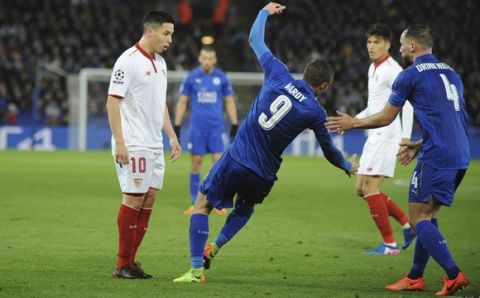 Leicester's Jamie Vardy falls after an incident with Sevilla's Samir Nasri, left, which resulted in a second yellow card for Nasri, during the Champions League round of 16 second leg soccer match between Leicester City and Sevilla at the King Power Stadium in Leicester, England, Tuesday, March 14, 2017. (AP Photo/Rui Vieira)