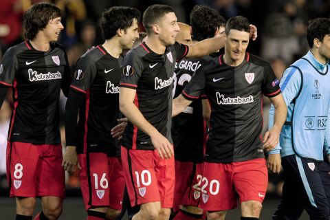 "Athletic Bilbao's players celebrate at the end of the UEFA Europa League round of 16 second leg football match between Valencia CF vs Athletic Club de Bilbao at the Mestalla stadium in Valencia on March 17, 2016. / AFP / JOSE JORDAN        (Photo credit should read JOSE JORDAN/AFP/Getty Images)"