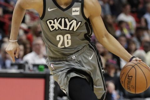 Brooklyn Nets guard Spencer Dinwiddie takes the ball down the court during the second half of an NBA basketball game against the Miami Heat, Saturday, Feb. 29, 2020, in Miami. (AP Photo/Wilfredo Lee)