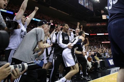 SAN ANTONIO, TX - APRIL 27:  Manu Ginobili #20 of the San Antionio Spurs celebrates with teammates after hitting a two pointer near the end of regulation against the Memphis Grizzlies in Game Five of the Western Conference Quarterfinals in the 2011 NBA Playoffs on April 27, 2011 at AT&T Center in San Antonio, Texas. NOTE TO USER: User expressly acknowledges and agrees that, by downloading and or using this photograph, User is consenting to the terms and conditions of the Getty Images License Agreement.  (Photo by Jed Jacobsohn/Getty Images)