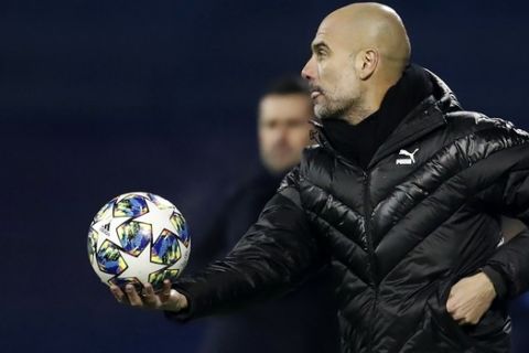 Manchester City's head coach Pep Guardiola reacts during the Champions League group C soccer match between Dinamo Zagreb and Manchester City at Maksimir Stadium in Zagreb, Croatia, Wednesday, Dec. 11, 2019. (AP Photo/Darko Bandic)