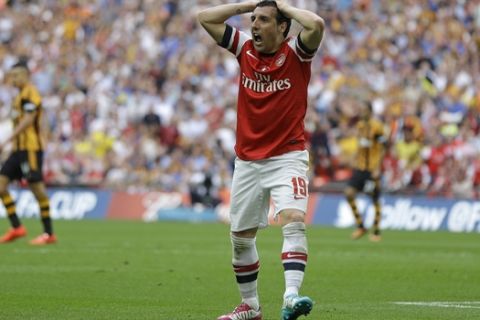 Arsenal's Santi Cazorla reacts after his appeal for a penalty is turned down during the English FA Cup final soccer match between Arsenal and Hull City at Wembley Stadium in London, Saturday, May 17, 2014. (AP Photo/Kirsty Wigglesworth) 
