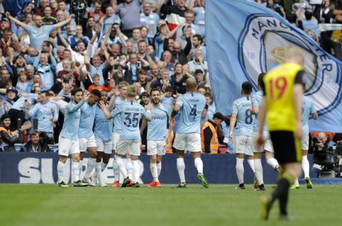 Manchester City players celebrate their side's fourth goal during the English FA Cup Final soccer match between Manchester City and Watford at Wembley stadium in London, Saturday, May 18, 2019. (AP Photo/Kirsty Wigglesworth)