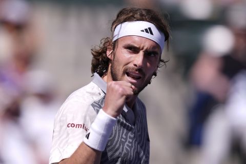Stefanos Tsitsipas, of Greece, reacts after winning a point against Frances Tiafoe, of the United States, at the BNP Paribas Open tennis tournament in Indian Wells, Calif., Sunday, March 10, 2024. (AP Photo/Ryan Sun)