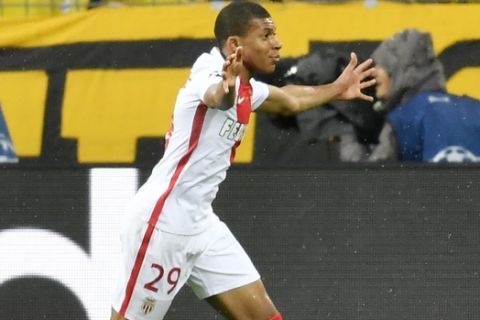 Monaco's Kylian Mbappe celebrates after scoring the opening goal during the Champions League quarterfinal first leg soccer match between Borussia Dortmund and AS Monaco in Dortmund, Germany, Wednesday, April 12, 2017. (AP Photo/Martin Meissner)