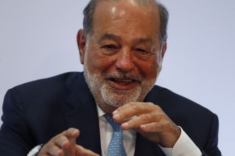 Mexican billionaire Carlos Slim gives a press conference in Mexico City, Monday, April 16, 2018. Slim says he would be concerned if leftist presidential candidate Andres Manuel Lopez Obrador wins the July 1 presidential election and cancels the new Mexico City airport project. (AP Photo/Eduardo Verdugo)