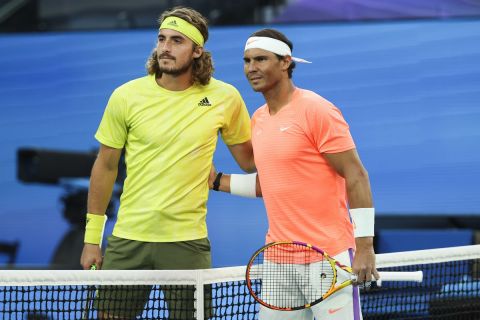 Spain's Rafael Nadal, right, and Greece's Stefanos Tsitsipas pose for a photo ahead of their quarterfinal match at the Australian Open tennis championship in Melbourne, Australia, Wednesday, Feb. 17, 2021.(AP Photo/Hamish Blair)