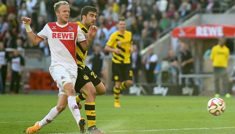 COLOGNE, GERMANY - OCTOBER 18:  Kevin Vogt of 1. FC Koeln scores their first goal during the Bundesliga match between 1. FC Koeln and Borussia Dortmund at RheinEnergieStadion on October 18, 2014 in Cologne, Germany.  (Photo by Dennis Grombkowski/Bongarts/Getty Images)