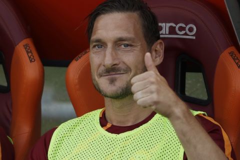 Roma's Francesco Totti gives the thumb up sign prior to an Italian Serie A soccer match between Roma and Genoa at the Olympic stadium in Rome, Sunday, May 28, 2017. Francesco Totti is playing his final match with Roma against Genoa after a 25-season career with his hometown club. (AP Photo/Alessandra Tarantino)