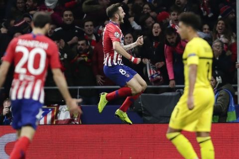 Atletico Saul Niguez, center, celebrates after scoring the opening goal during the Group A Champions League soccer match between Atletico Madrid and Borussia Dortmund at the Wanda Metropolitano stadium in Madrid, Spain, Tuesday, Nov. 6, 2018. (AP Photo/Manu Fernandez)