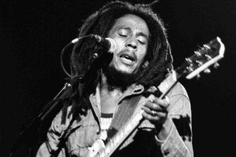 FILE - In this July 4, 1980 file photo, Jamaican Reggae singer Bob Marley performs at a reggae festival concert  in Paris. "Marley," a documentary about Bob Marley, the charismatic icon of reggae music, directed by  Kevin MacDonald, will be released worldwide on Friday, April 20, 2012, and was premiered in the singer's Caribbean homeland on Thursday. (AP Photo/file)