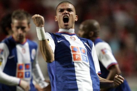 FC Porto's Pepe, from Brazil, celebrates after scoring the opening goal against Benfica during their Portuguese league soccer match Sunday, April 1 2007, at Benfica's Luz stadium in Lisbon, Portugal. (AP Photo/Armando Franca)