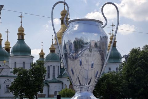 A huge replica of the Champions League trophy is placed in front of St. Sophia Cathedral, in Kiev, Ukraine, Wednesday, May 23, 2018. Liverpool will play Real Madrid in the Champions League Final on May 26 at the Olympiyski stadium in Kiev. (AP Photo/Efrem Lukatsky)