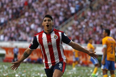 Chivas' Alan Pulido celebrates scoring against Tigres during the Mexican soccer league final match in Guadalajara, Mexico, Sunday, May 28, 2017. Chivas won the match and the championship 2-1. (AP Photo/Eduardo Verdugo)