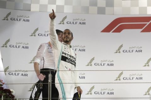 Mercedes driver Lewis Hamilton of Britain gestures from the podium after winning the Bahrain Formula One Grand Prix at the Bahrain International Circuit in Sakhir, Bahrain, Sunday, March 31, 2019. (AP Photo/Hassan Ammar)