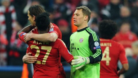 MUNICH, GERMANY - MARCH 13: Manuel Neuer of Bayern Muenchen celebrates with David Alaba after the UEFA Champions League Round of 16 second leg match between Bayern Muenchen and Arsenal at Allianz Arena on March 13, 2013 in Munich, Germany.  (Photo by Stuart Franklin/Bongarts/Getty Images)