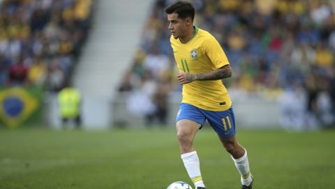 Brazil's Philippe Coutinho runs with the ball during the friendly soccer match between Brazil and Panama at the Dragao stadium in Porto, Portugal, Saturday, March 23, 2019. (AP Photo/Luis Vieira)