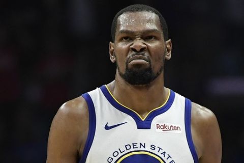 Golden State Warriors forward Kevin Durant scowls after scoring during the second half in Game 6 of a first-round NBA basketball playoff series against the Los Angeles Clippers Friday, April 26, 2019, in Los Angeles. The Warriors won 129-110. (AP Photo/Mark J. Terrill)
